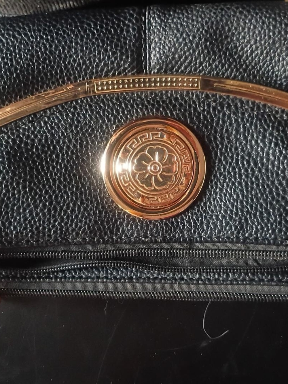 Black Leather Travel Bag with Gold Accent